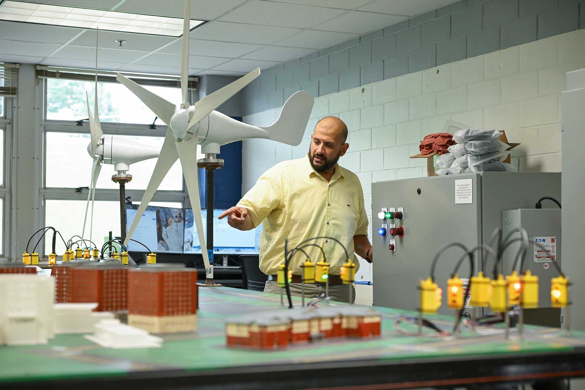 Students talking with a teacher in the PRT Lab