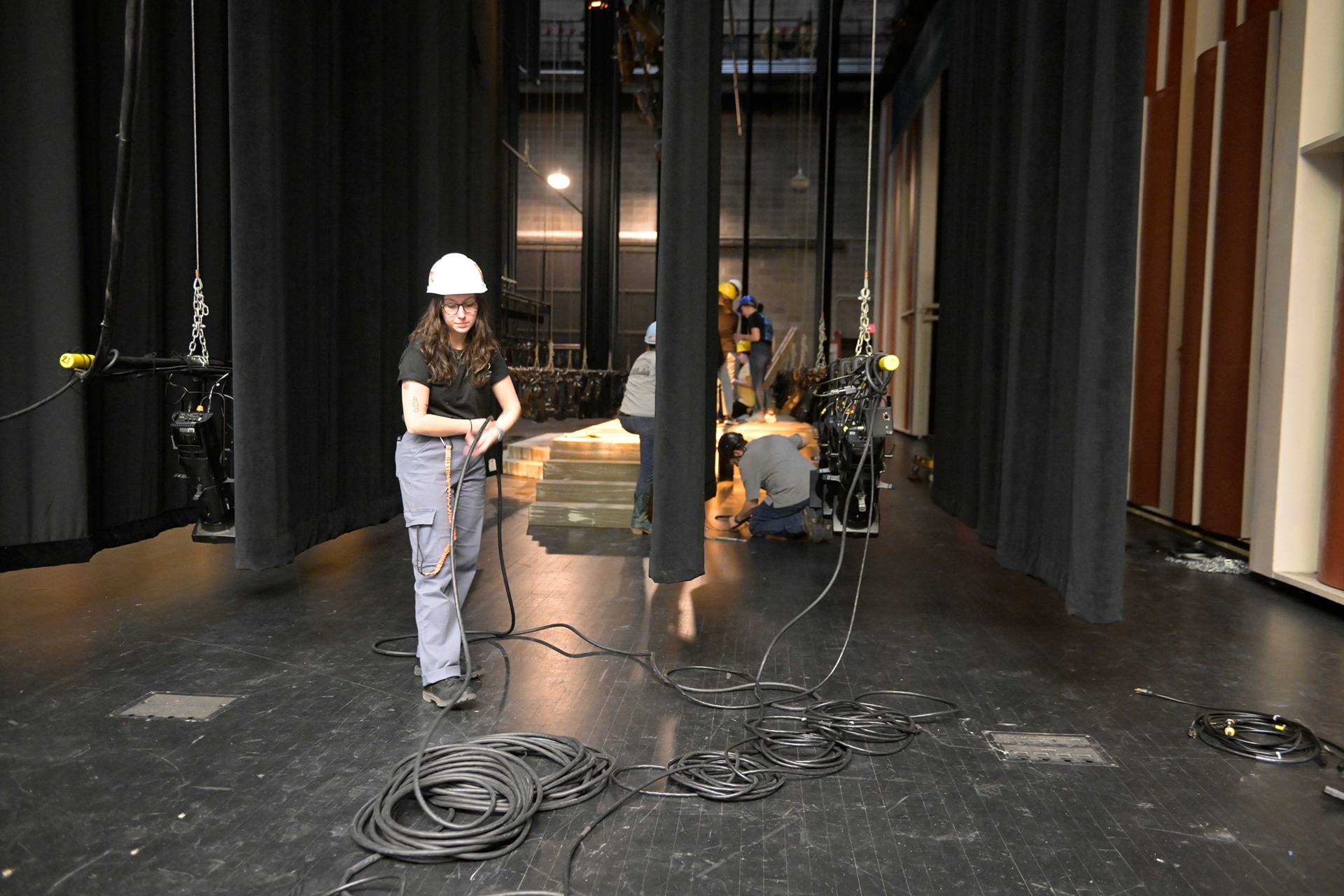Student coiling a power cord