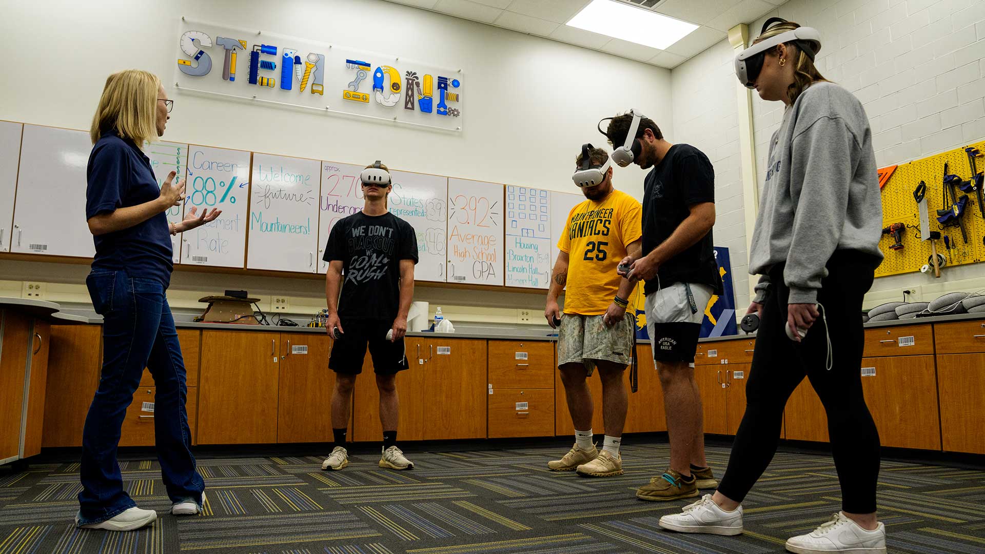 Mining Engineering faculty member Amy McBrayer leads her Aggregates Production class in using VR headsets in the STEM Zone