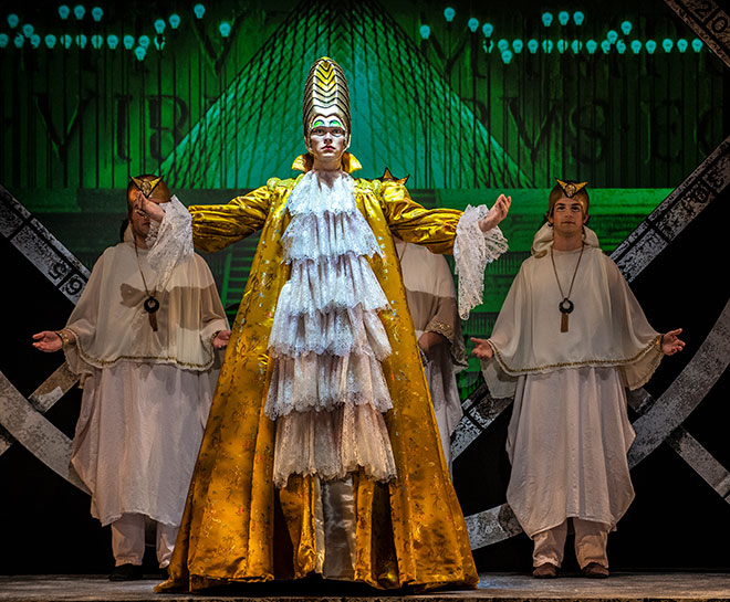 Actor in flowing white and gold costume