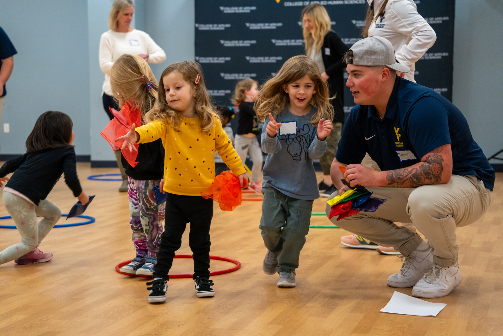 Student leads activity for group of Nursery School children