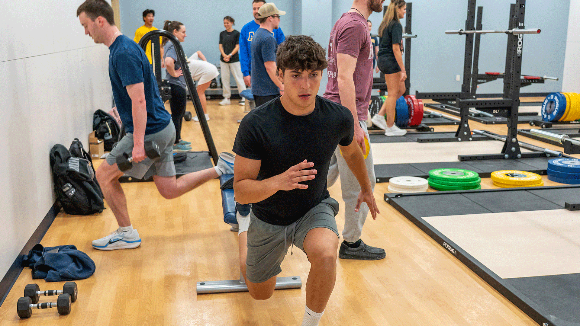 Students stretching in the Strength and Conditioning Training lab