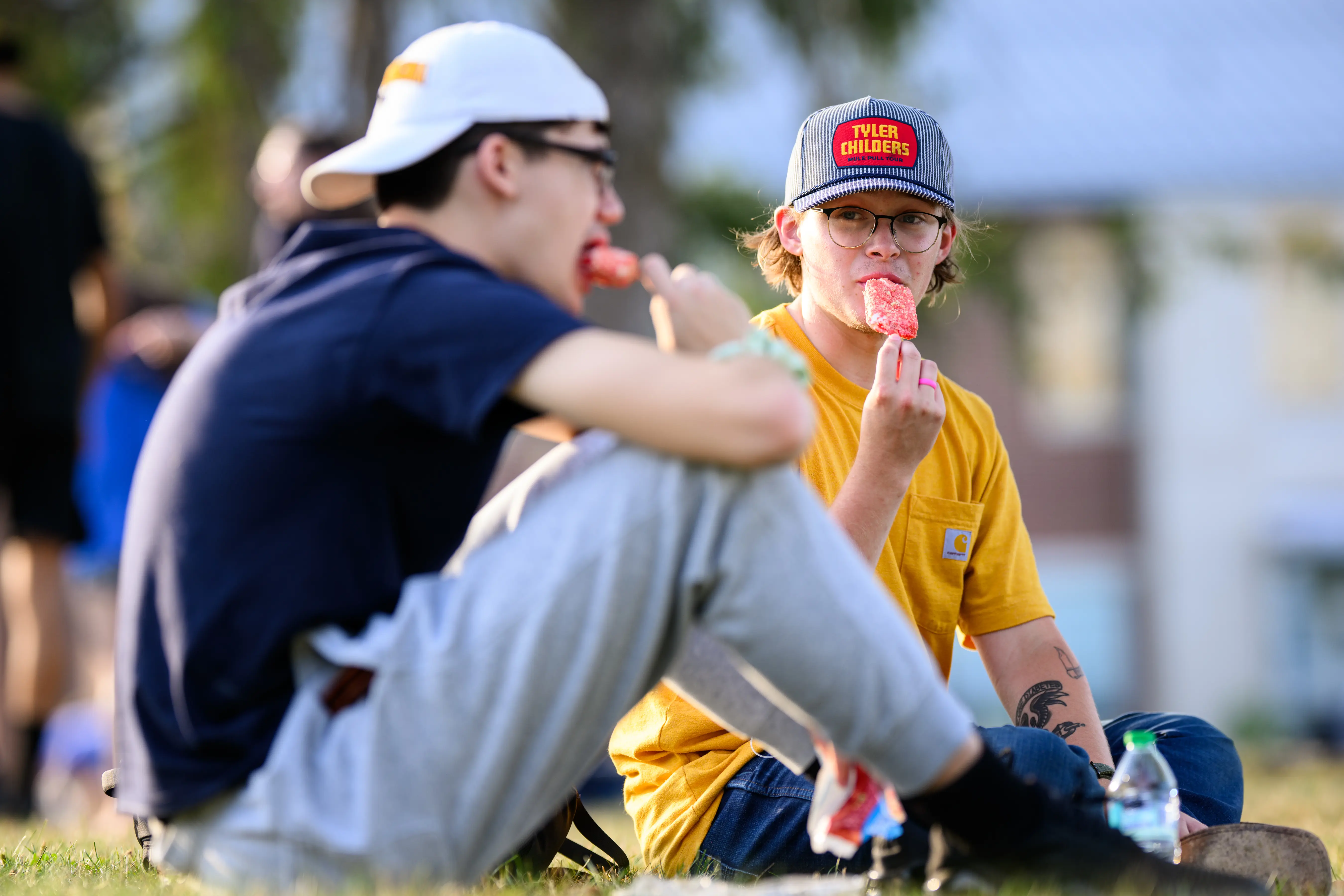 Students eating popsicles on the Mountainlair lawn.