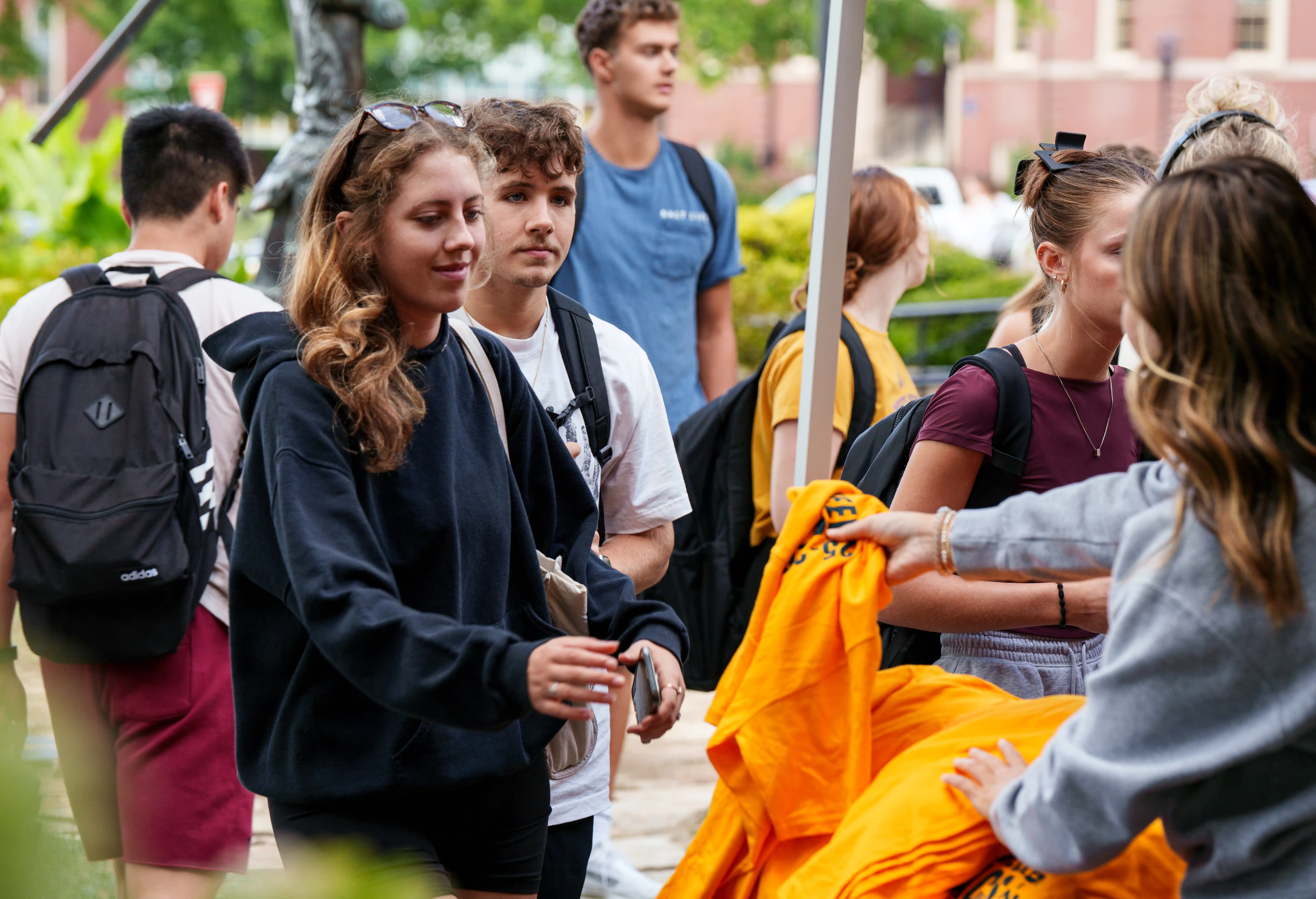 Students getting their Mountaineer Maniac T-shirt at Mountaineer Friday