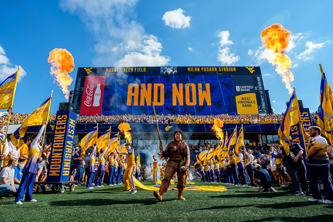 West Virginia Mountaineer mascot Cade Kincaid leads the team onto the field before the Mountaineers defeat the Pitt Panthers in overtime, 31-24, in the Backyard Brawl on Saturday, September 13, 2025, at Milan Puskar Stadium, in Morgantown, WV.