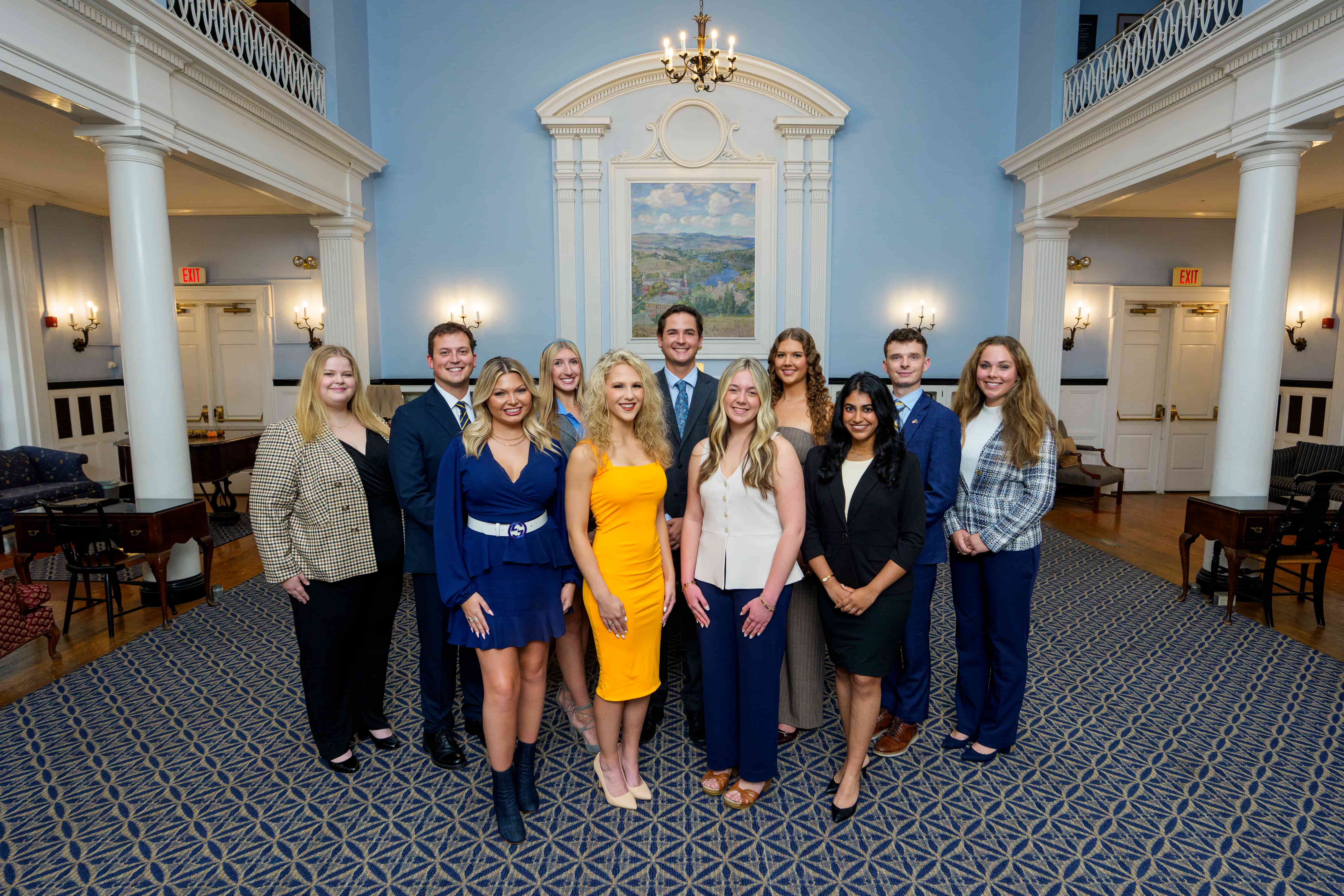 The 2025 WVU Homecoming Court is shown at E. Moore Hall — back row (from left), Julia Leyden, Logan Pierce, Kayla Bordogna, Christopher Morrison, Macey Barritt, Michael Taylor and Sydney Hickle; front row (from left), Bella Randle, Minah Moine, Payton Ogden and Laya Chennuru.