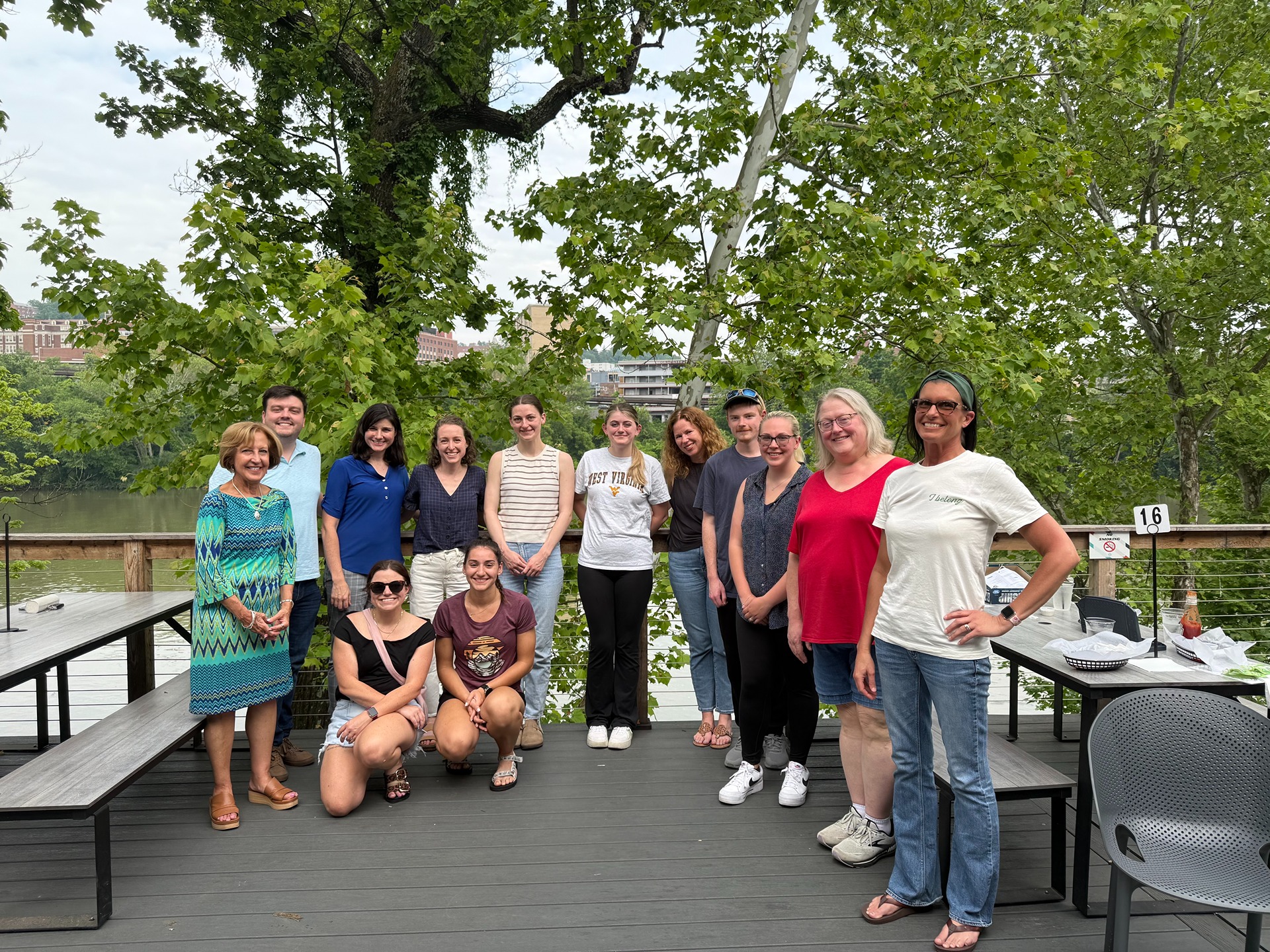 Teachers Ascend members gather on a deck overlooking a river.