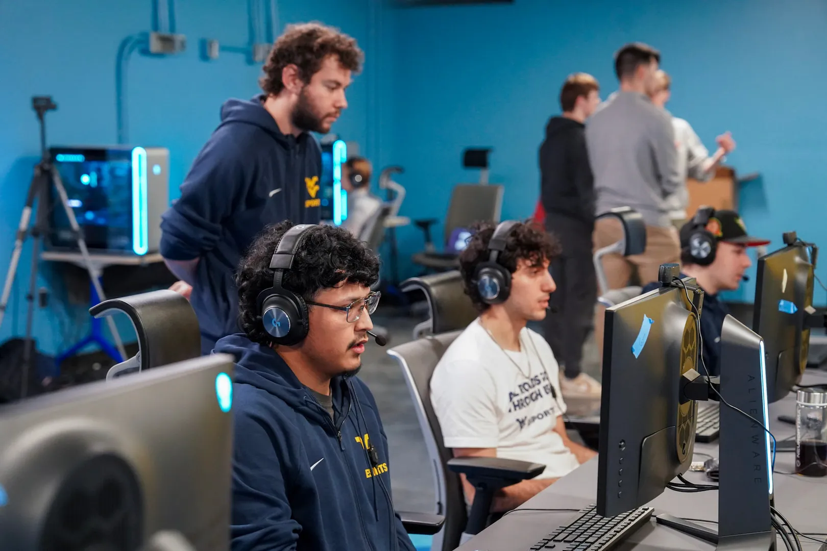 Jarret Birch watches esports athletes practice to help develop them into stronger players